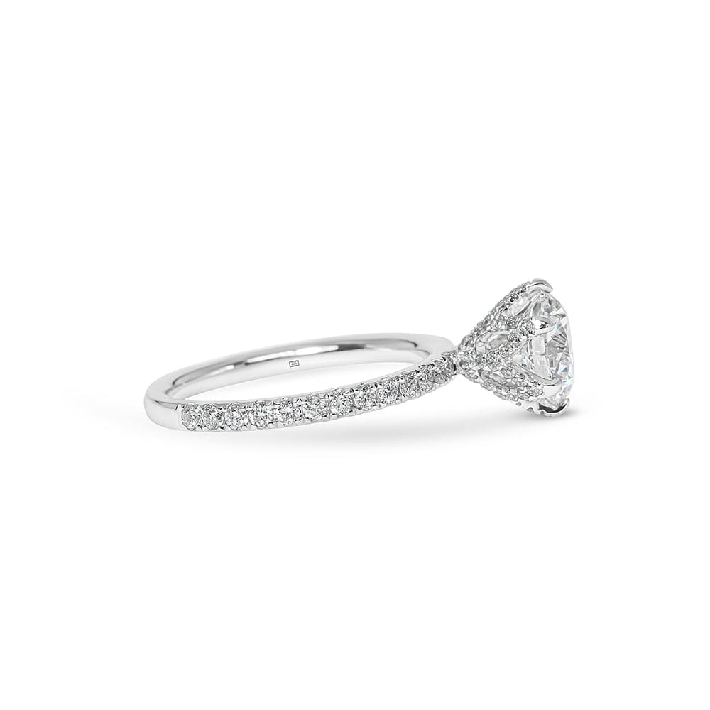 Melody Round Cut Diamond with Diamonds Basket & Sidestones Engagement Ring