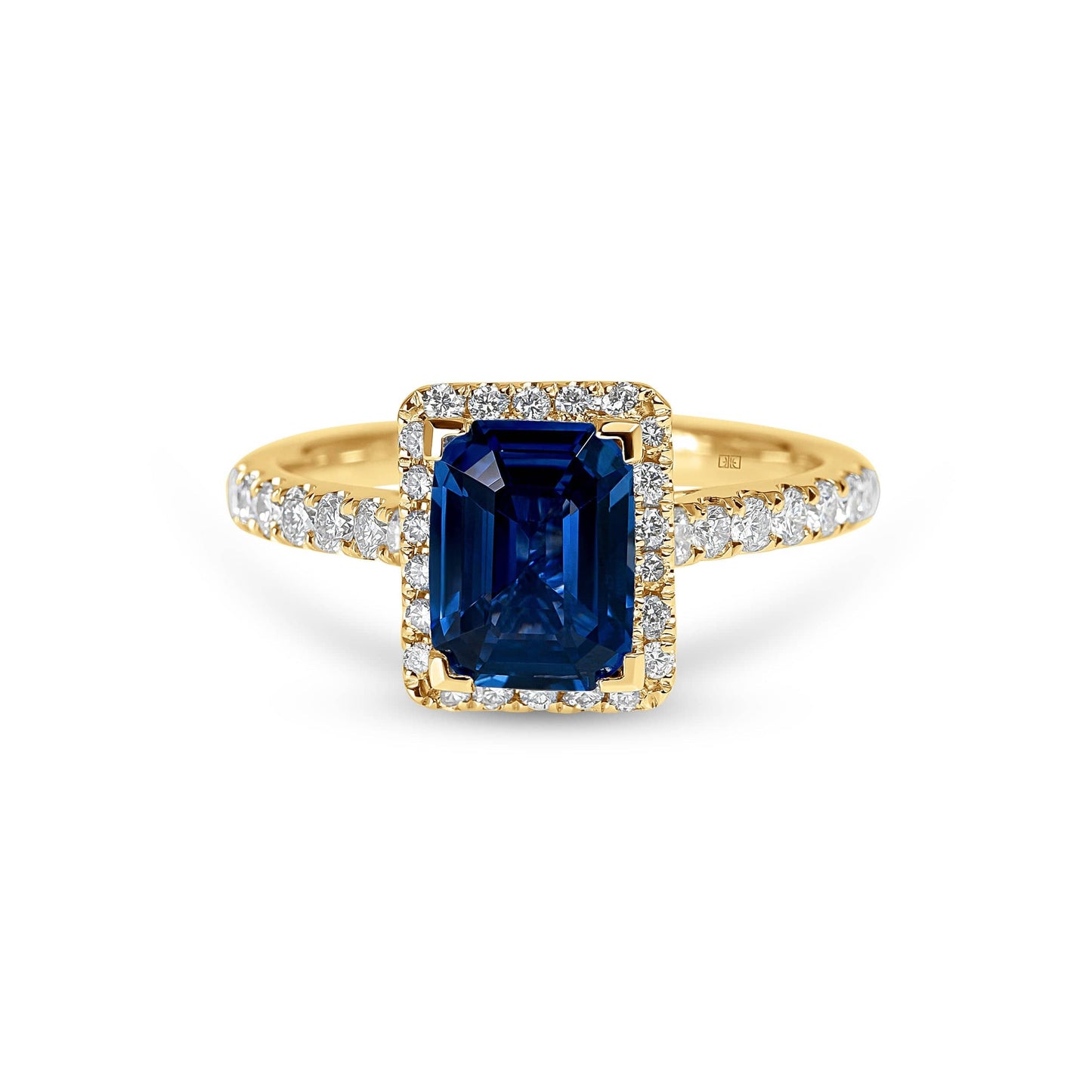 Emerald Cut Sapphire with Sidestones & Halo Diamond Ring