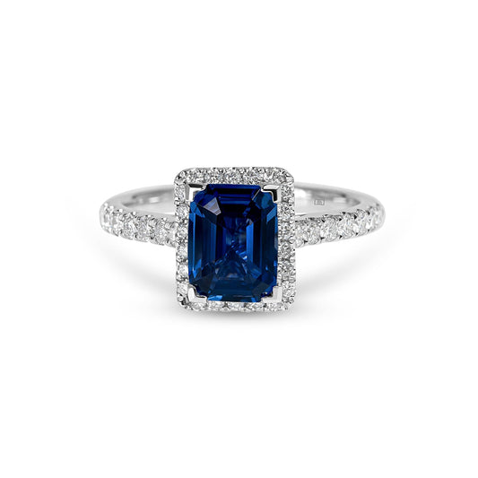 Emerald Cut Sapphire with Sidestones & Halo Diamond Ring