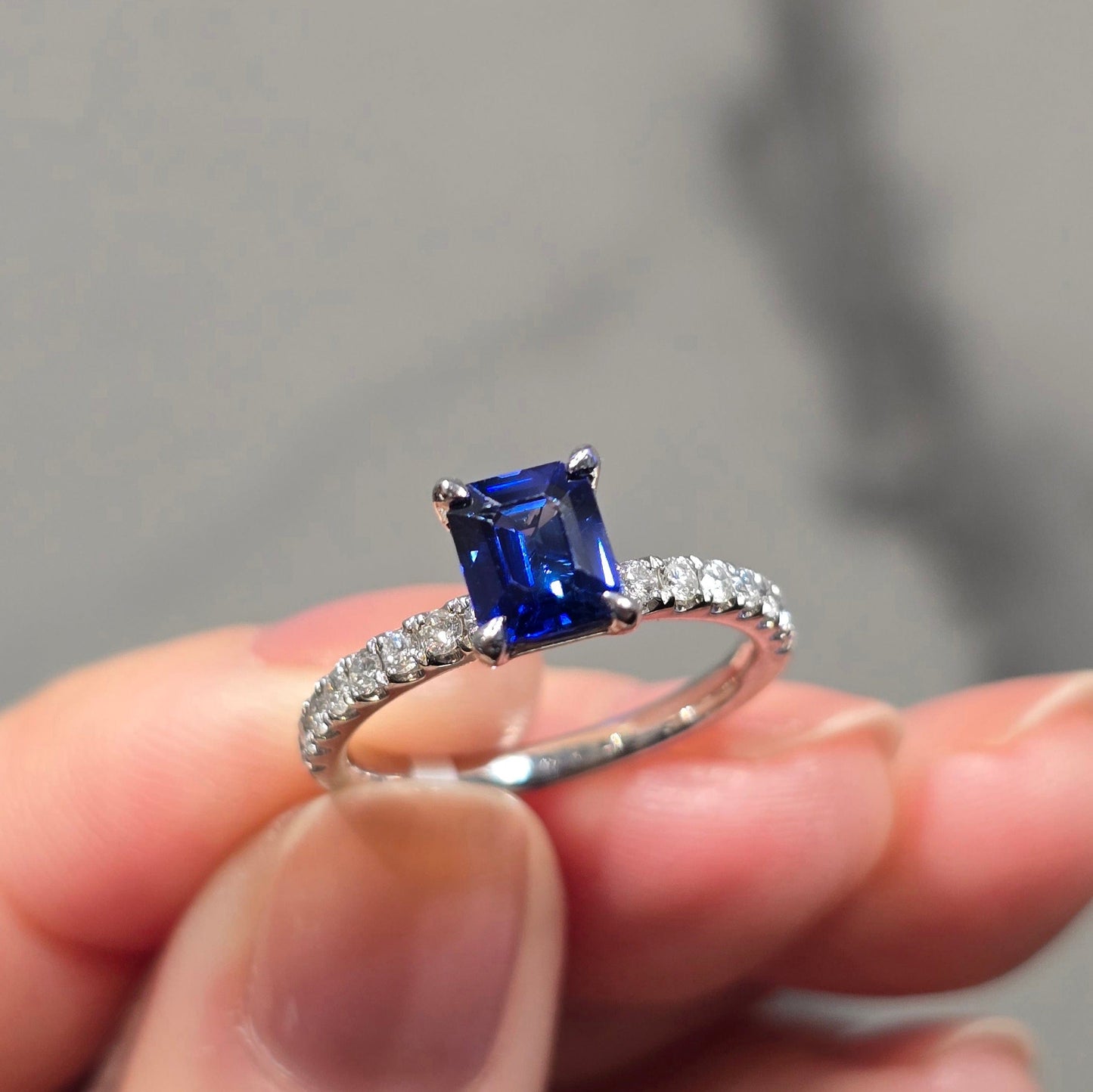Emerald Cut Sapphire Solitaire & Side Stone Diamond Ring