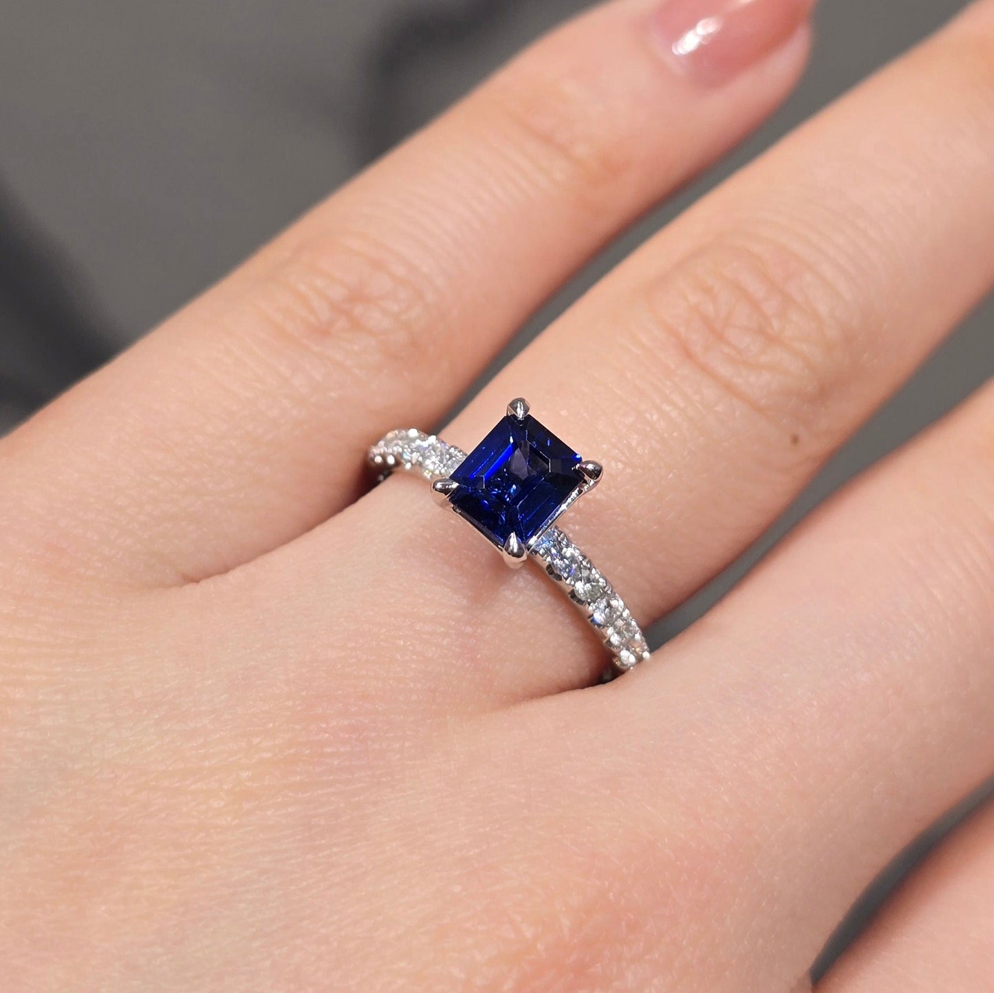 Emerald Cut Sapphire Solitaire & Side Stone Diamond Ring