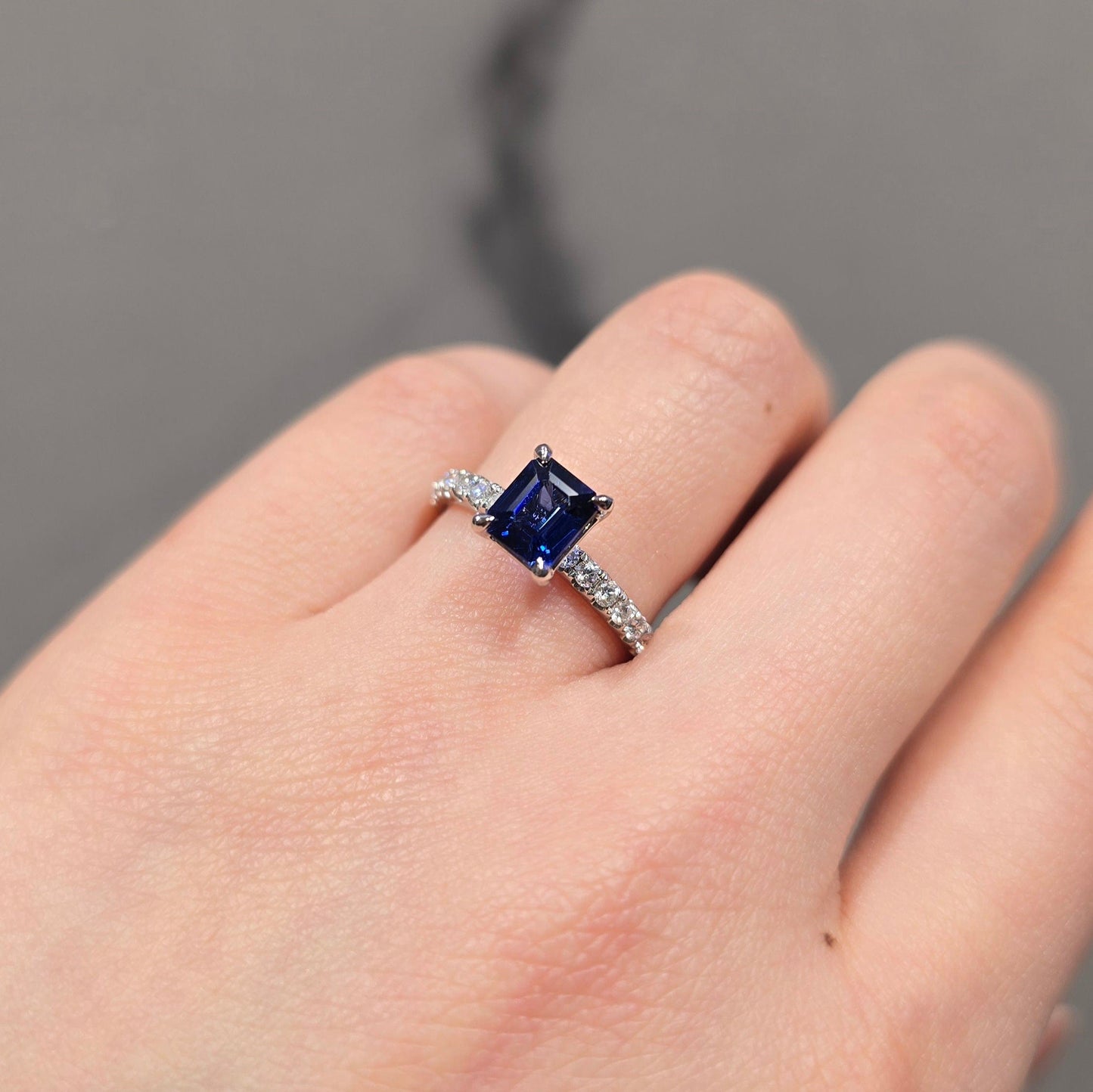Emerald Cut Sapphire Solitaire & Side Stone Diamond Ring
