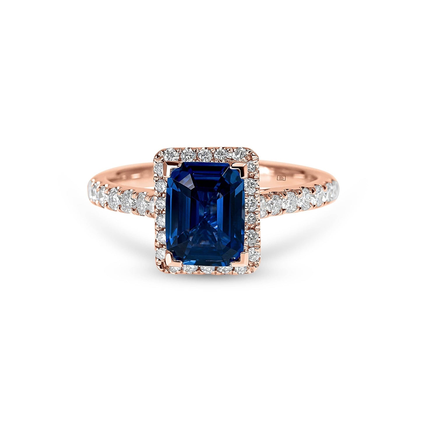 Emerald Cut Sapphire with Sidestones & Halo Diamond Ring